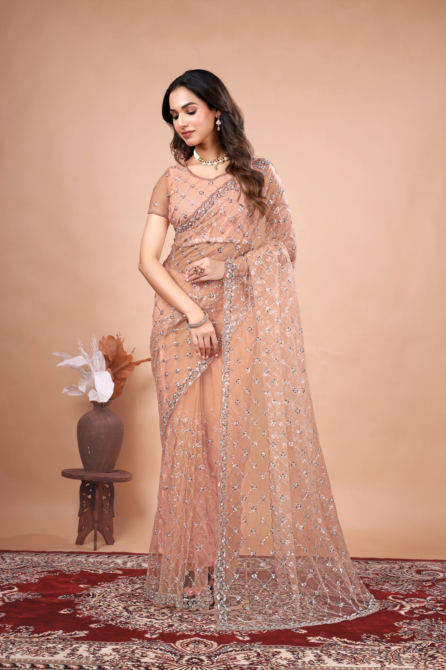 Cross Stylish Orange Net saree with Cutdana Work