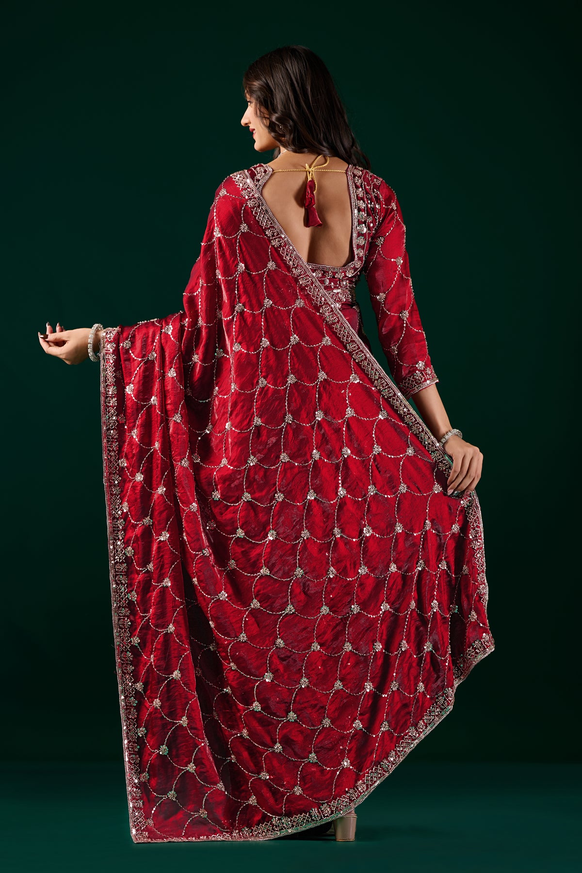 Kanyaari Rashmika luxury silk saree with rose gold cutdana work in wine color, featuring intricate embroidery and elegant drape.