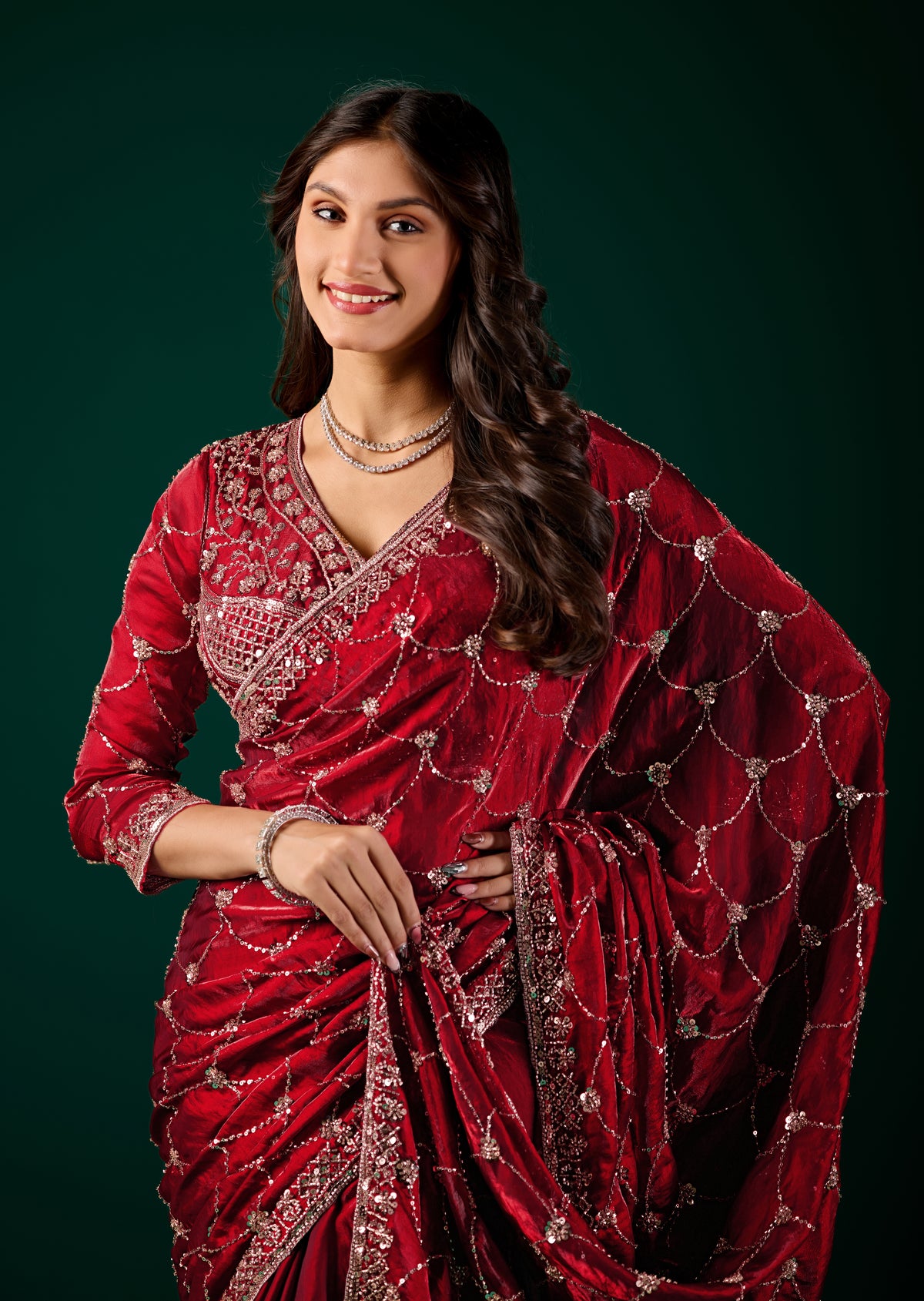 Kanyaari Rashmika luxury silk wine saree with rose gold cutdana work, intricate embroidery, and elegant drape.