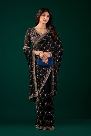 Black silk saree with rose gold cutdana work, luxury design by Kanyaari, showcasing intricate embroidery and elegant drape.