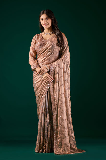 Luxury silk saree by Kanyaari featuring rose gold cutdana work and elegant gold embroidery for a sophisticated look.