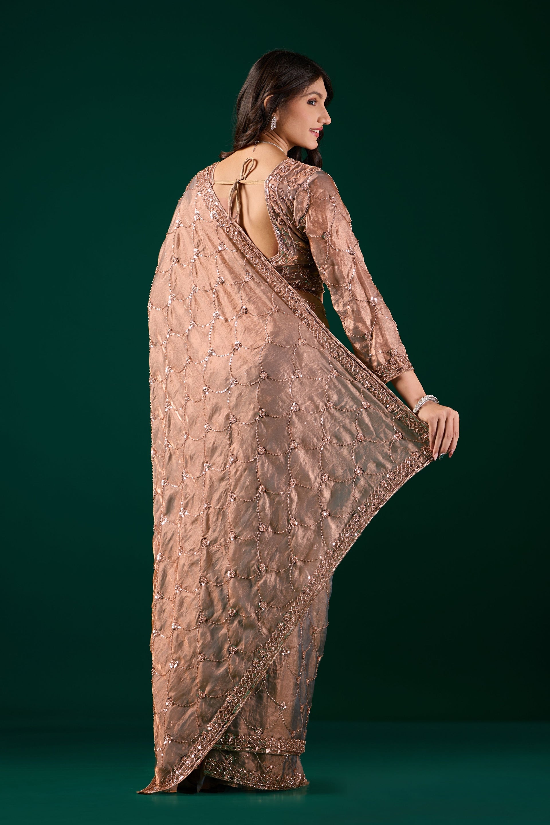 Elegant silk saree with rose gold cutdana work by Kanyaari, showcasing intricate embroidery and luxurious fabric.