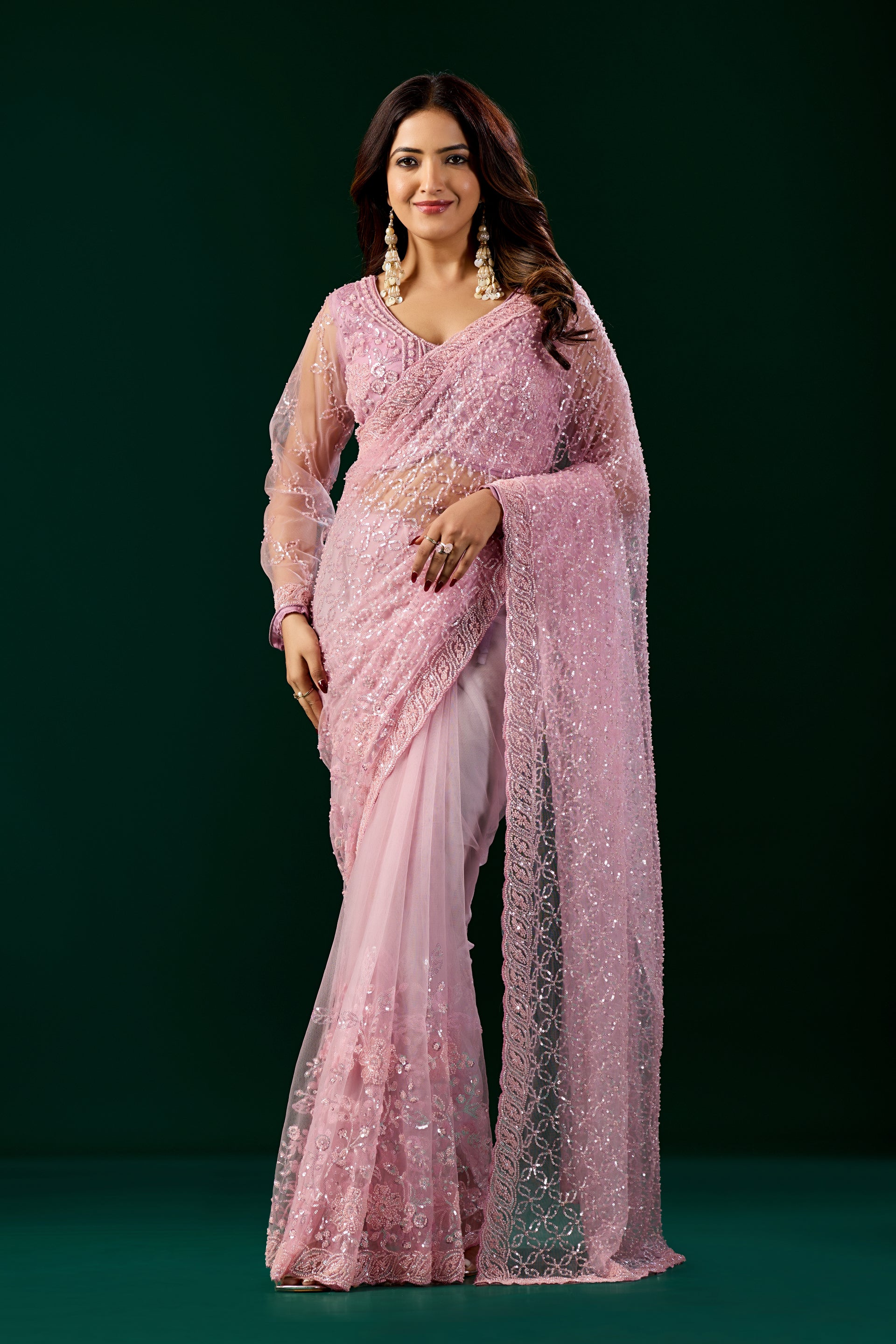 Pink embroidered saree with heavy cutdana work from Kanyaari's Styalish Net collection, featuring intricate embroidery and elegant draping.