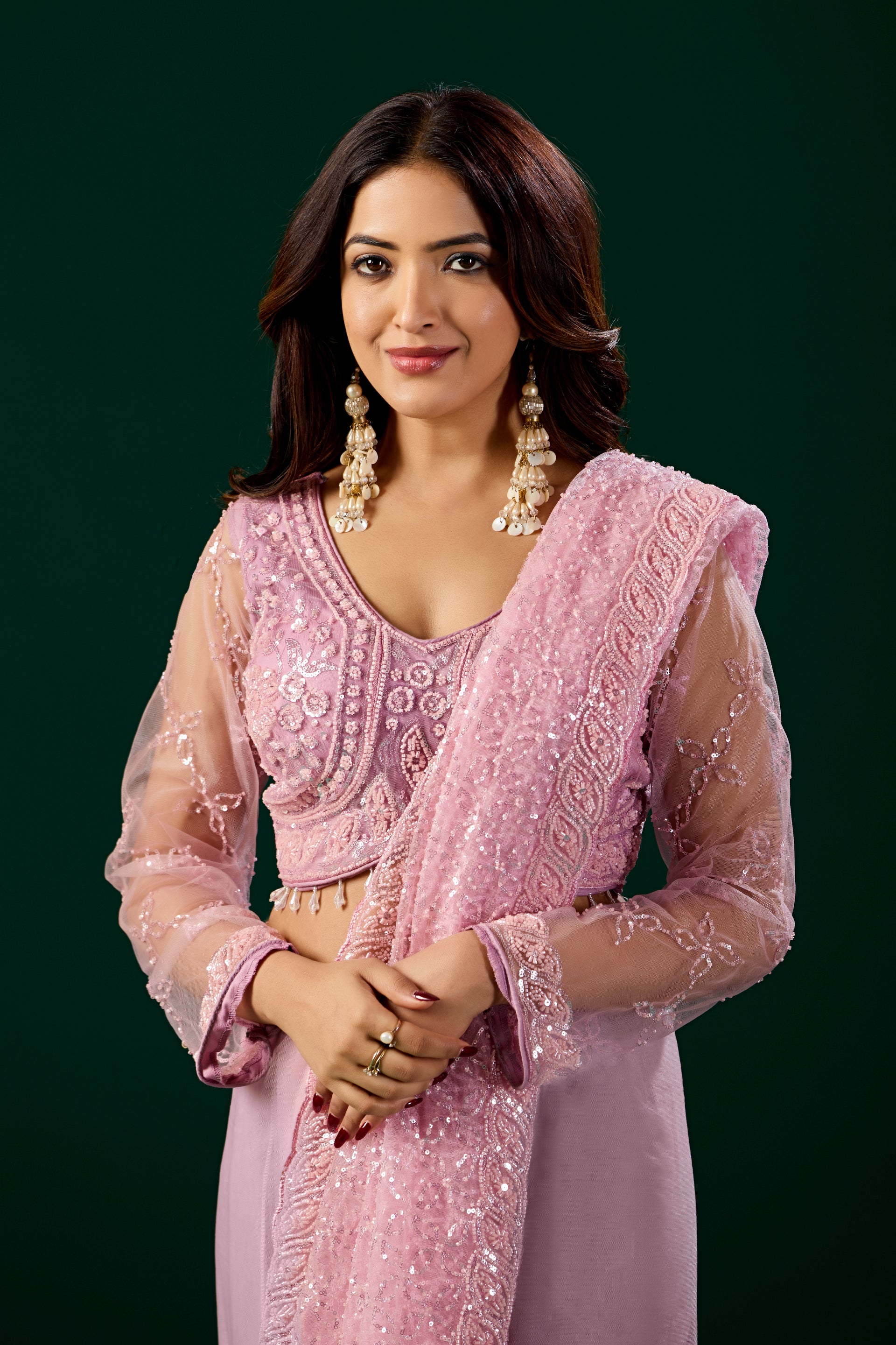 Pink embroidered saree with heavy cutdana work from Kanyaari, featuring intricate net fabric and detailed embroidery.