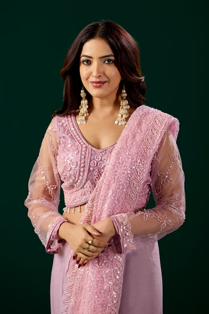 Pink embroidered saree with heavy cutdana work from Kanyaari, featuring intricate net fabric and detailed embroidery.