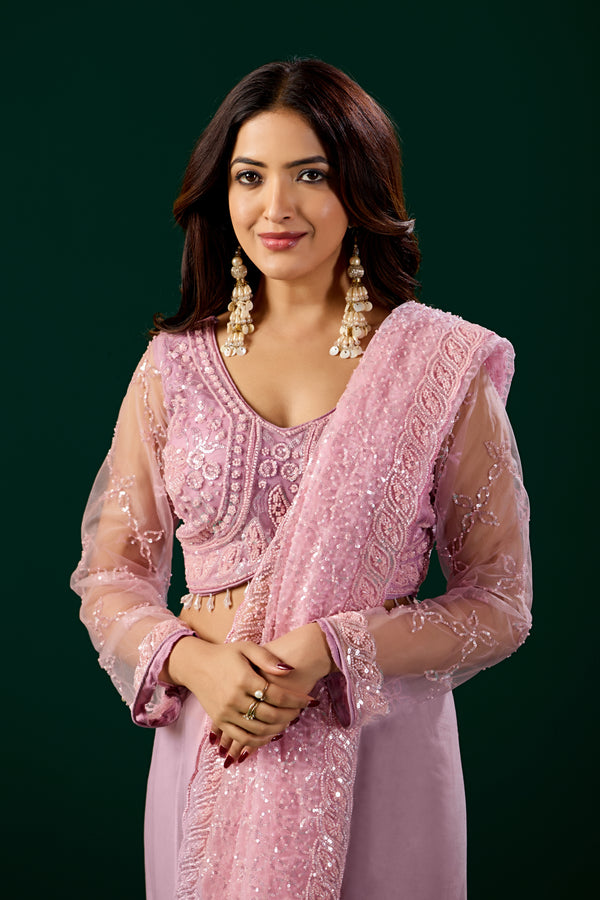 Pink embroidered saree with heavy cutdana work from Kanyaari, featuring intricate net fabric and detailed embroidery.