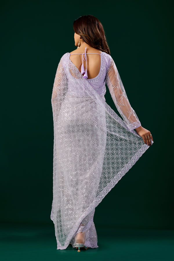 Purple Kanyaari saree with heavy cutdana embroidery and net fabric, styled with intricate embroidered details.