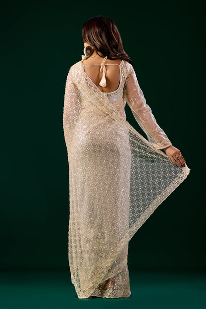 Cream Kanyaari saree with heavy cutdana embroidery and net fabric, featuring elegant traditional design.