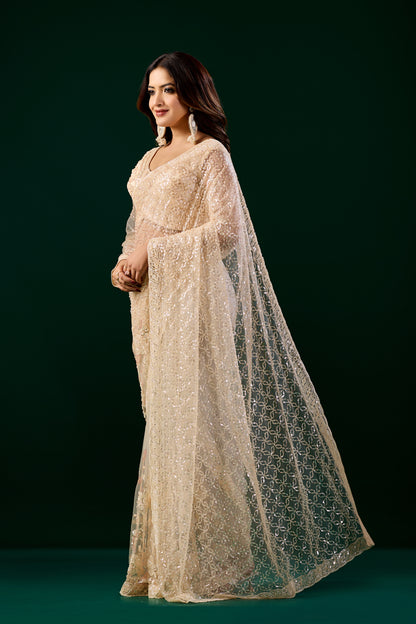 Kanyaari Styalish Net heavy cutdana embroidered cream saree with intricate embroidery and elegant drape design.