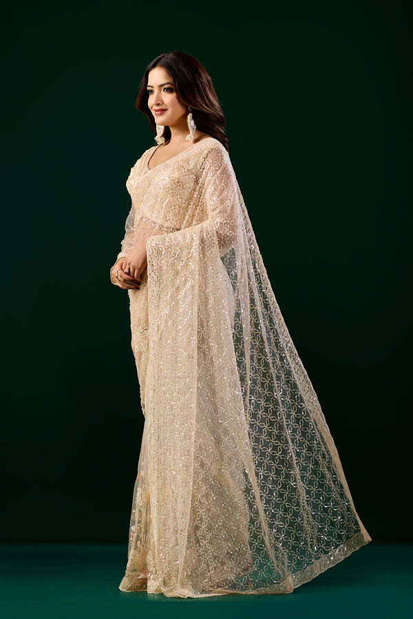 Kanyaari Styalish Net heavy cutdana embroidered cream saree with intricate embroidery and elegant drape design.