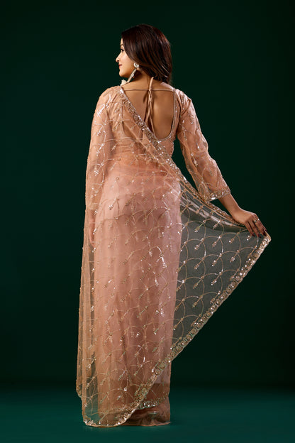 Orange Kanyaari saree with heavy cutdana embroidery and net fabric, featuring intricate embroidered patterns.