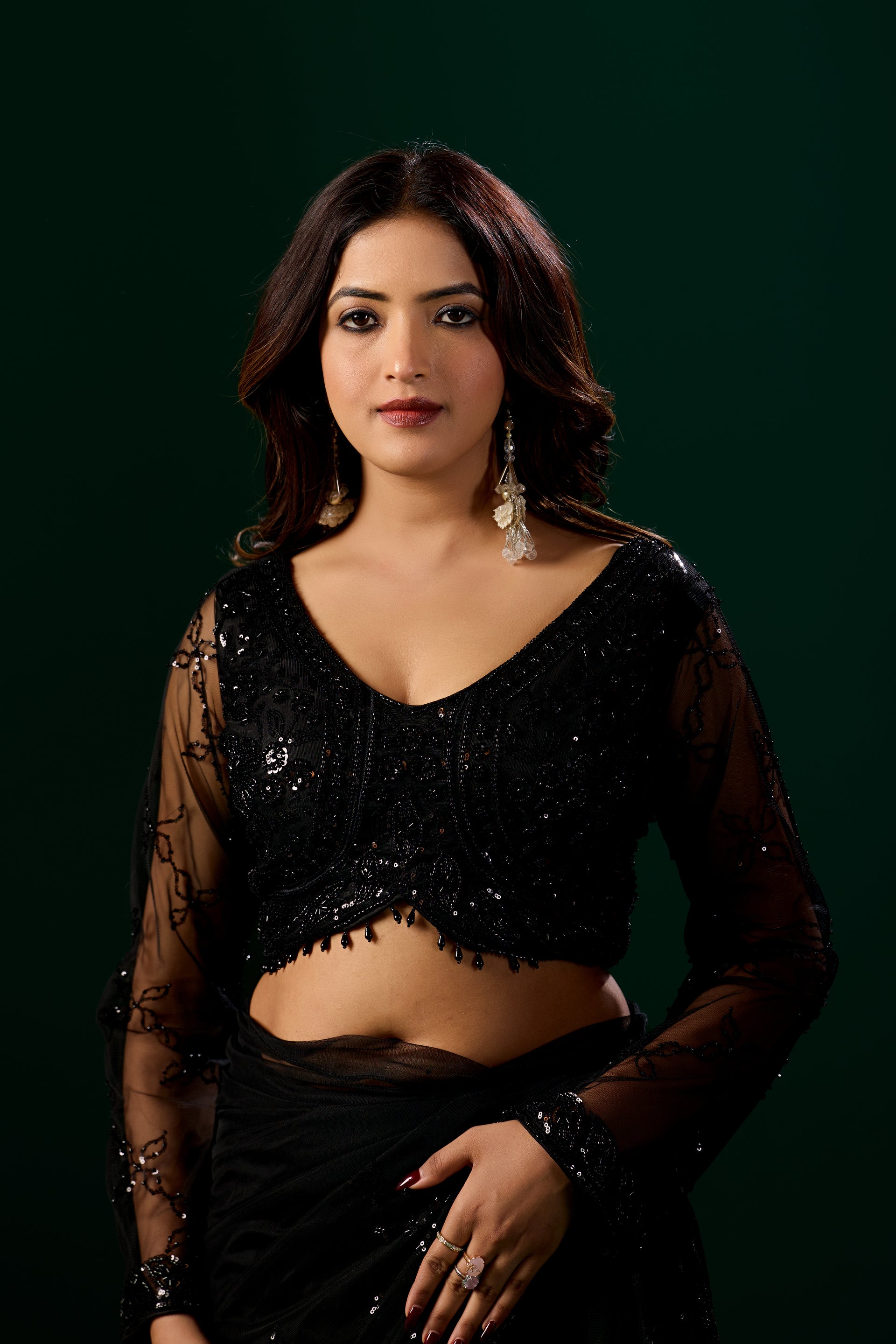 Kanyaari black net saree with intricate handwork and unstitched blouse, showcasing elegant traditional Indian attire.