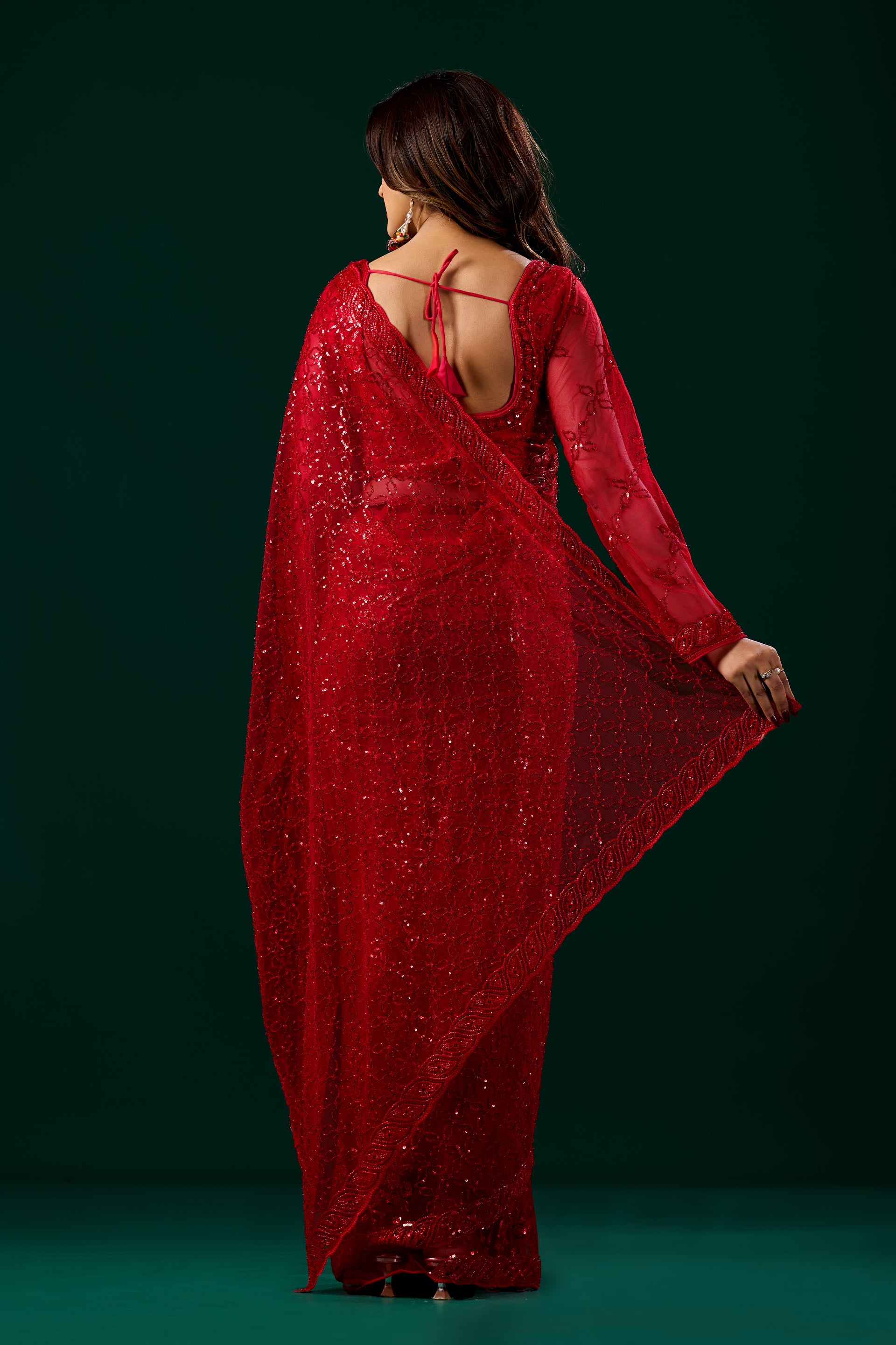 Red Cutdana saree with unstitched blouse from Kanyaari, featuring intricate embroidery and lightweight fabric.