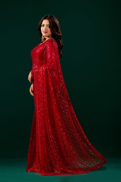 Red Cutdana saree with intricate detailing and unstitched blouse, displayed on a mannequin showcasing traditional Indian attire.