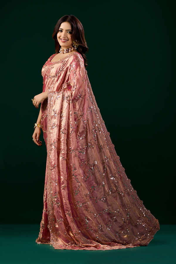Pink silk saree by Kanyaari with rose gold cutdana embroidery, showcasing intricate design and elegant drape.