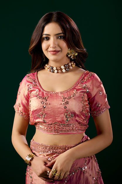 Pink silk saree with rose gold cutdana embroidery by Kanyaari, showcasing elegant traditional craftsmanship.