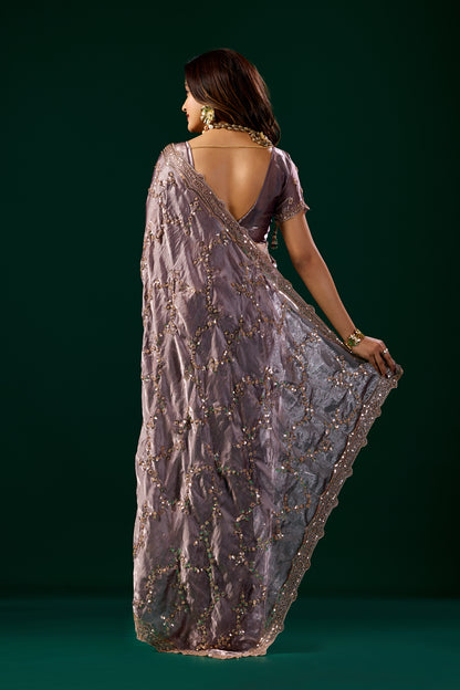 Kanyaari premium purple lavender saree with rose gold cutdana work, showcasing intricate embroidery and elegant fabric detail.