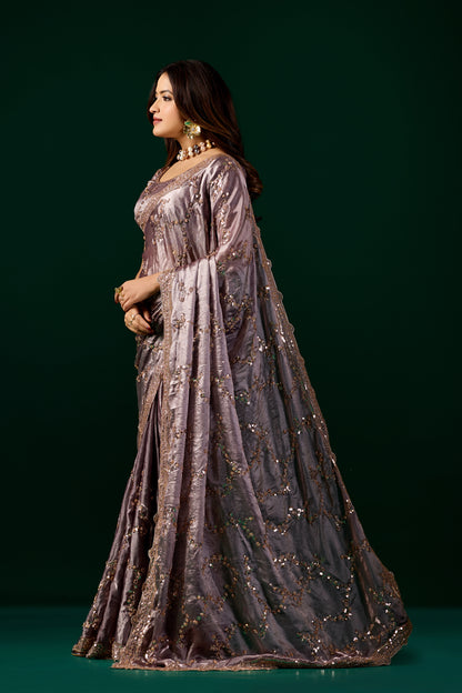 Kanyaari premium silk purple lavender saree with rose gold cutdana embroidery, showcasing intricate design and elegant drape.