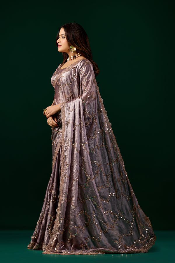 Kanyaari premium silk purple lavender saree with rose gold cutdana embroidery, showcasing intricate design and elegant drape.