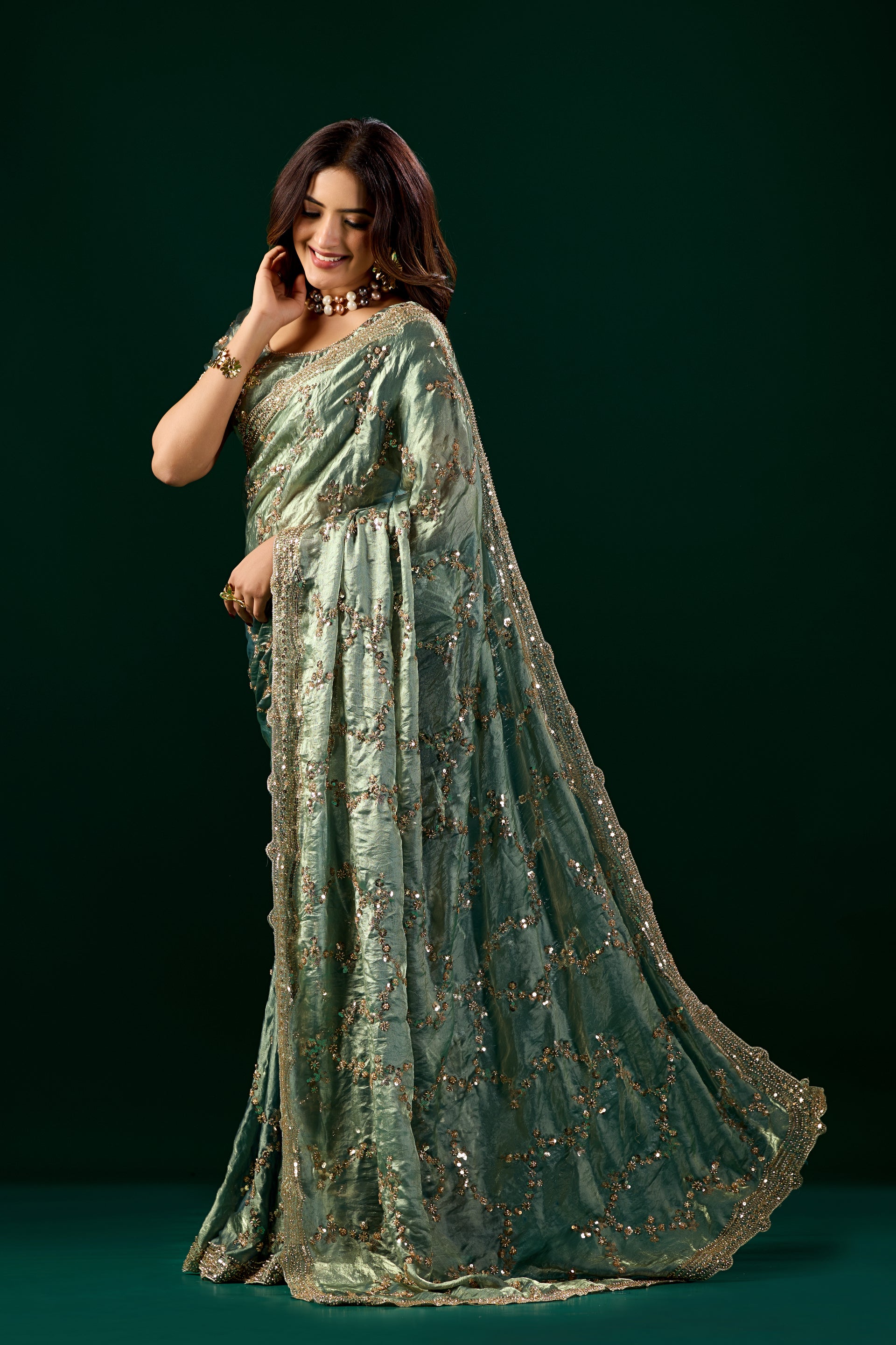 Kanyaari premium silk green saree with rose gold cutdana work, traditional Nakhrali design, elegant and vibrant for special occasions.