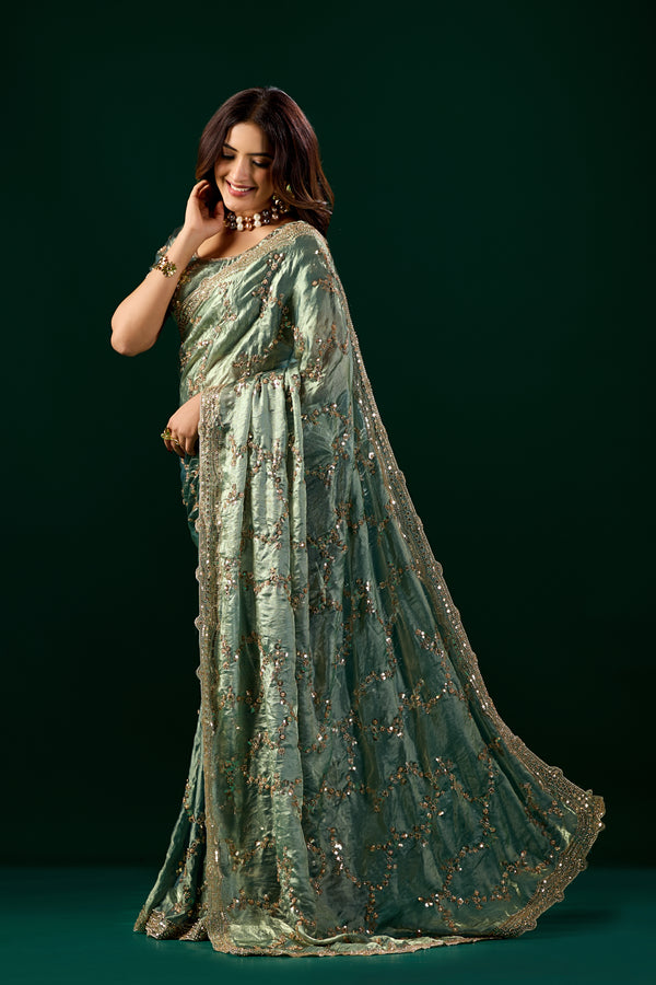 Kanyaari premium silk green saree with rose gold cutdana work, traditional Nakhrali design, elegant and vibrant for special occasions.