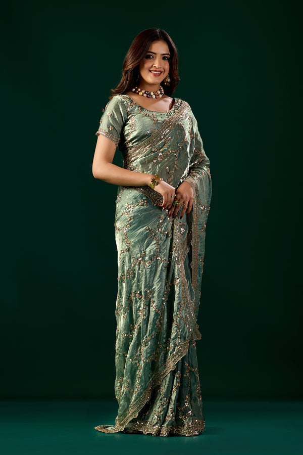 Kanyaari premium silk bottle green saree with rose gold cutdana work, elegant traditional Indian attire.