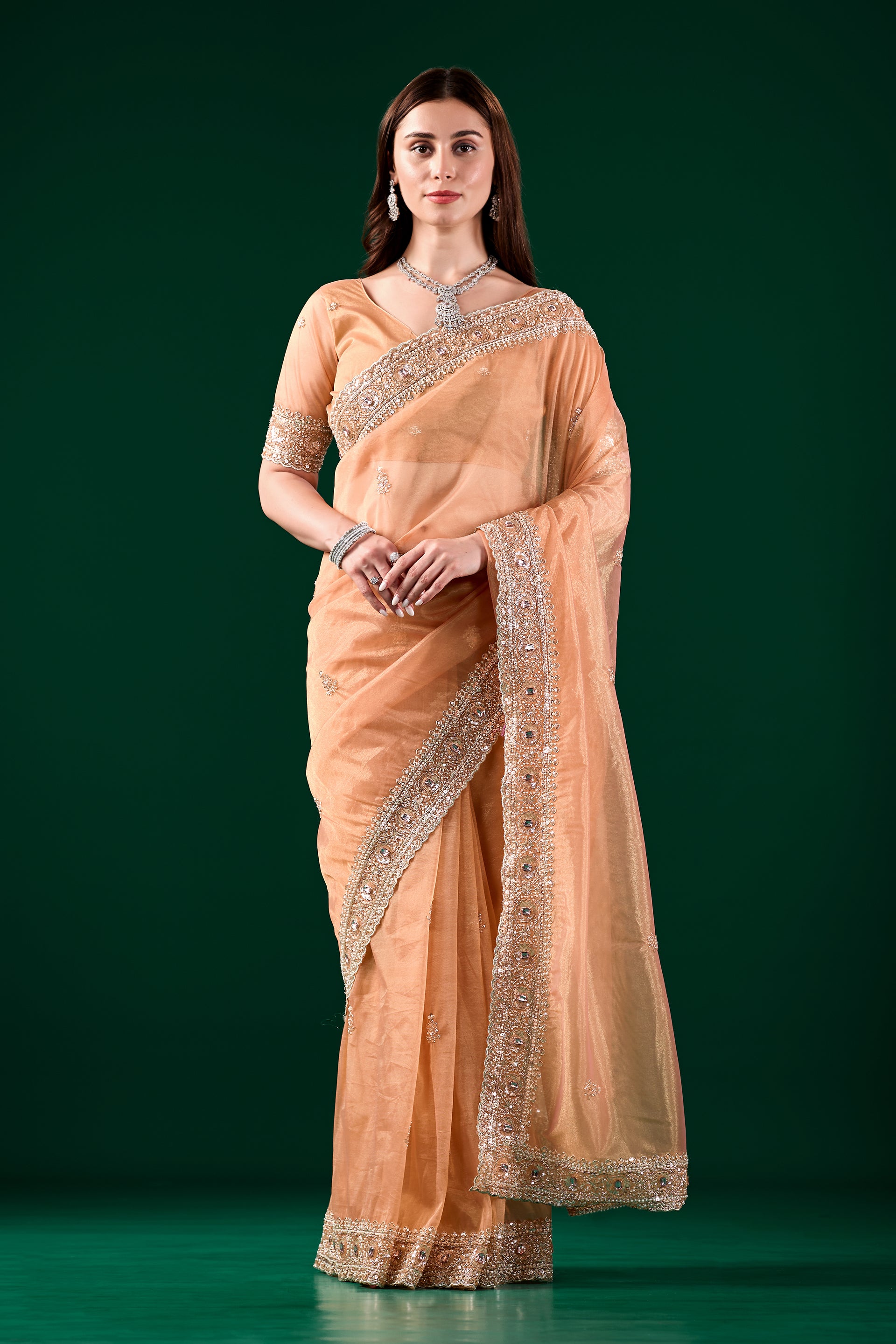 Kanyaari Kundan premium silk orange saree with rose gold cutdana work, intricate traditional embroidery and elegant drape.