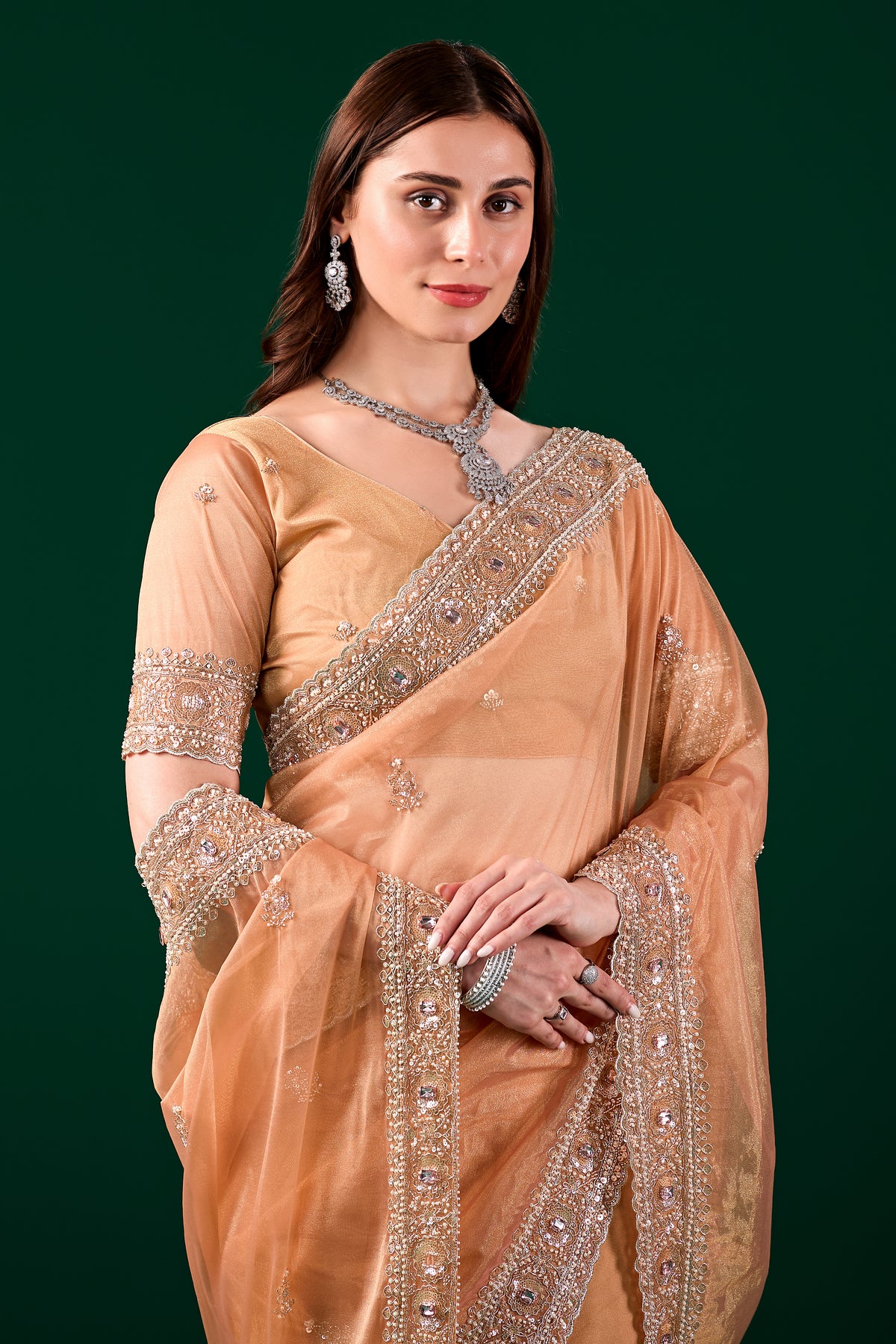 Kanyaari Kundan premium silk orange saree with rose gold cutdana embroidery, showcasing intricate traditional craftsmanship.
