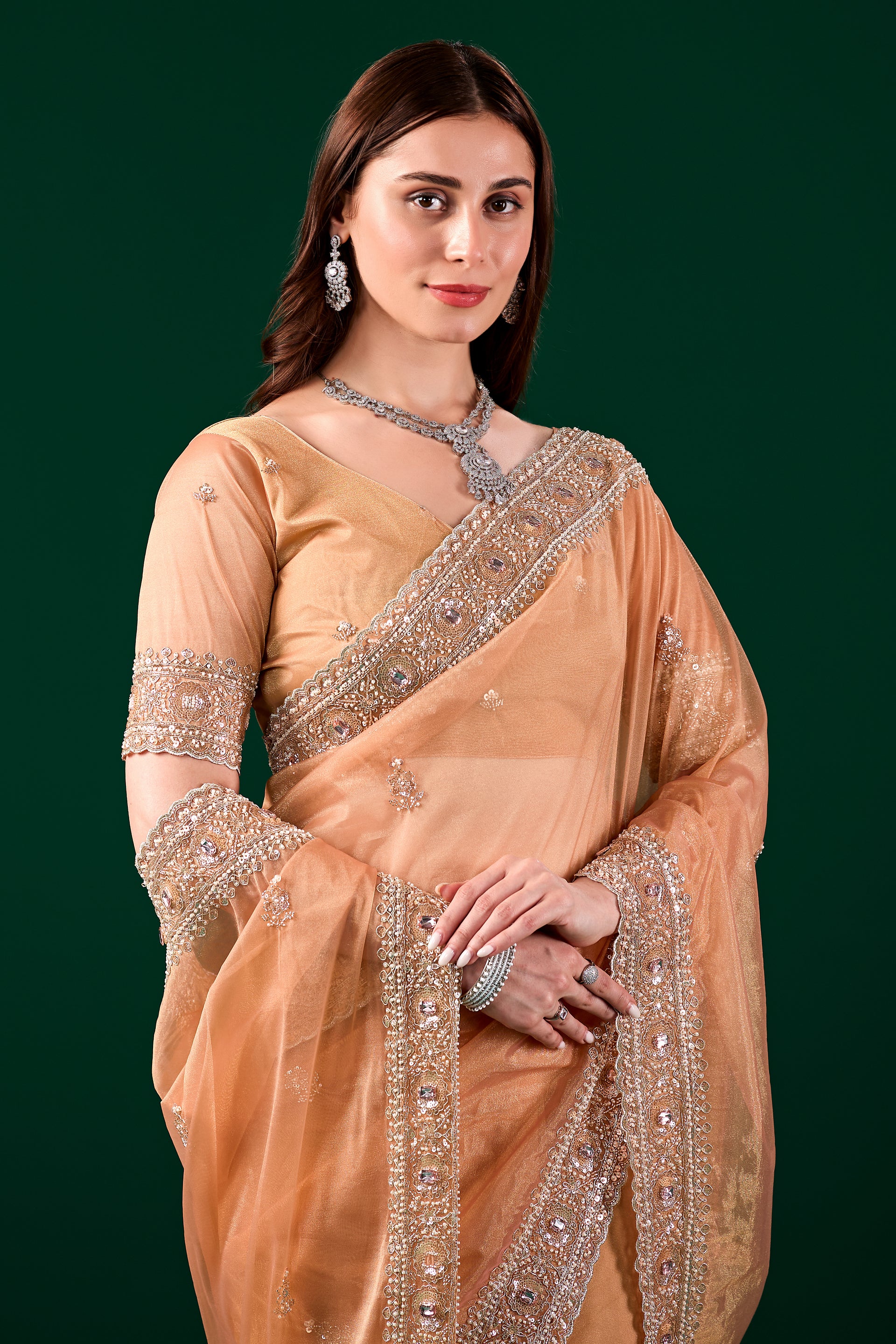 Kanyaari Kundan premium silk orange saree with rose gold cutdana embroidery, showcasing intricate traditional craftsmanship.