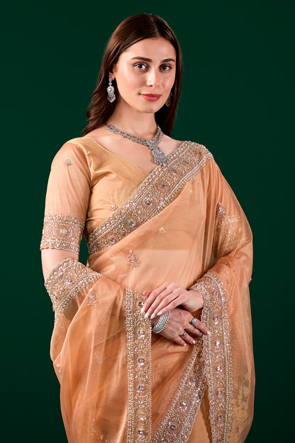 Kanyaari Kundan premium silk orange saree with rose gold cutdana embroidery, showcasing intricate traditional craftsmanship.