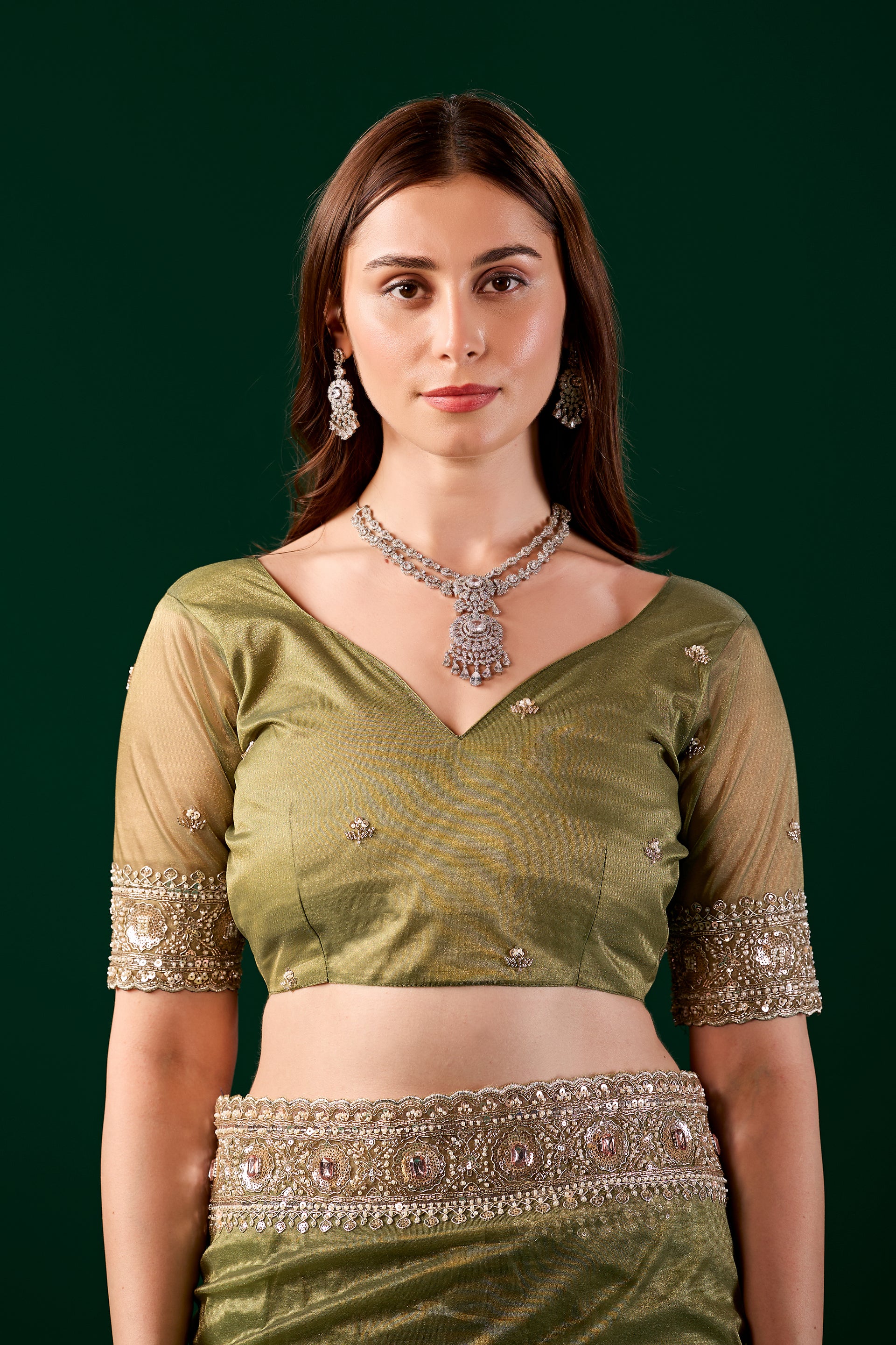 Kanyaari Kundan premium silk green saree with rose gold cutdana work and intricate embroidery.