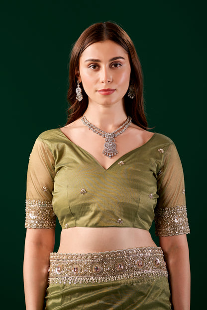 Kanyaari Kundan premium silk green saree with rose gold cutdana work and intricate embroidery.