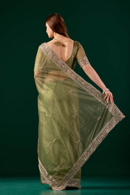 Kanyaari Kundan Premium Silk Green Saree with intricate rose gold cutdana work and traditional draping style.
