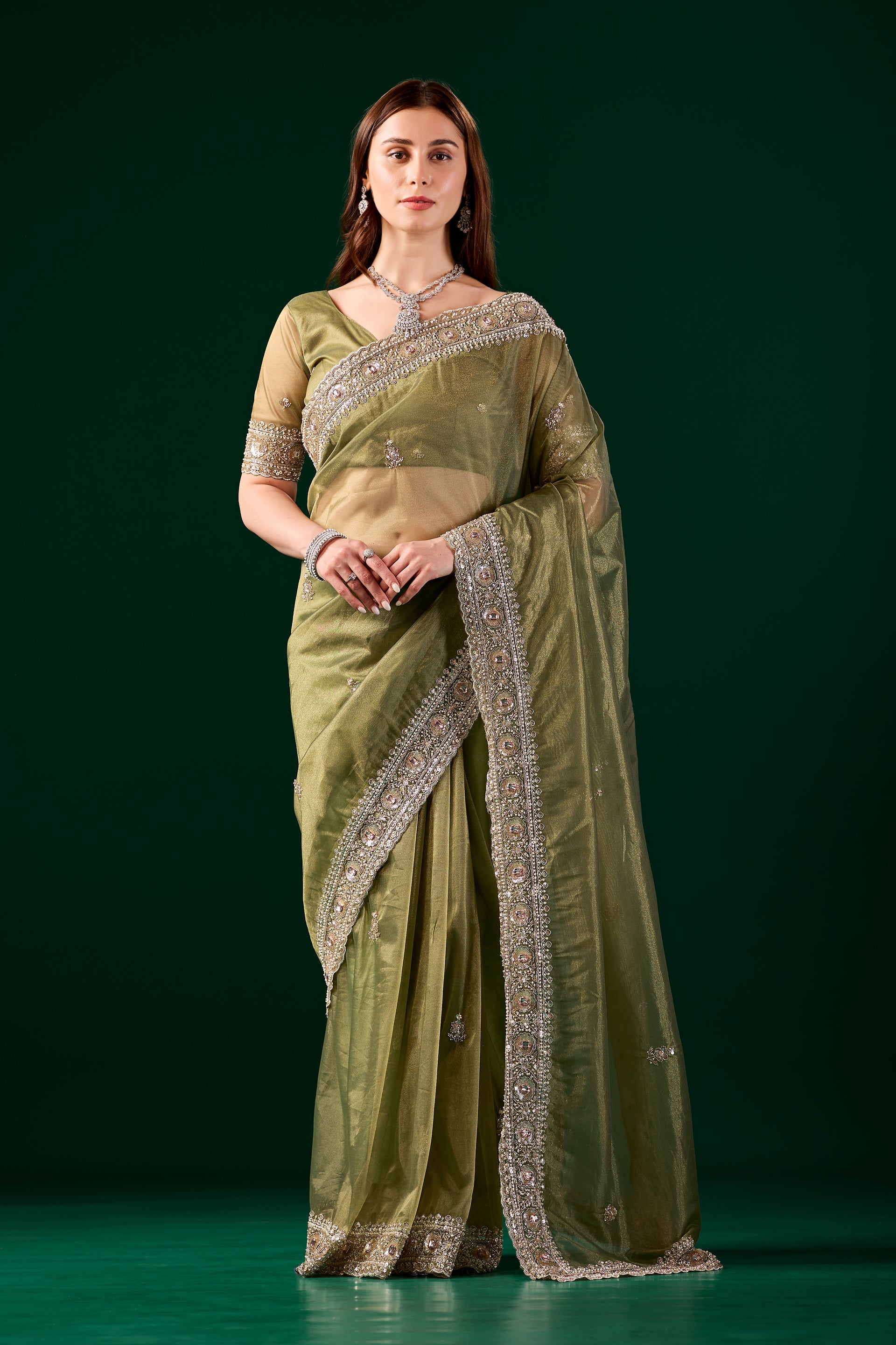 Kanyaari Kundan premium silk green saree with rose gold cutdana work, showcasing intricate embroidery and elegant drape.