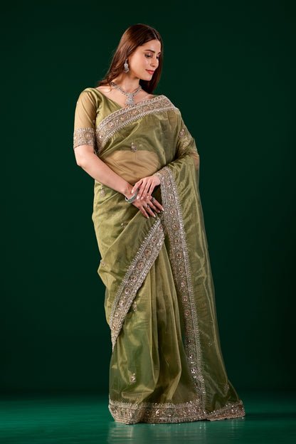 Kanyaari green silk saree with Kundan and rose gold cutdana embroidery, traditional Indian attire with intricate design.