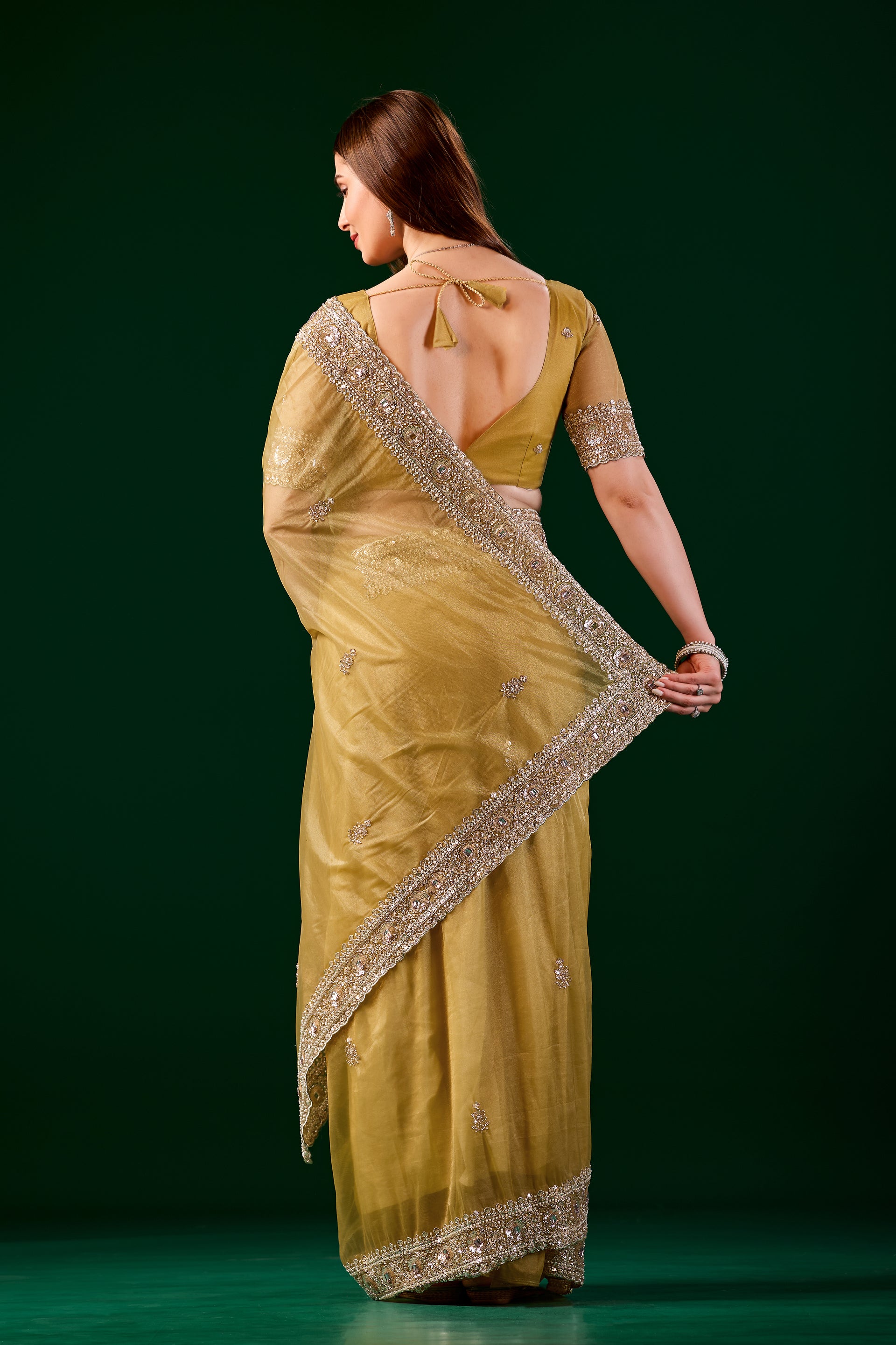 Kanyaari Kundan premium silk yellow saree with intricate rose gold cutdana work, traditional Indian attire with elegant drape.
