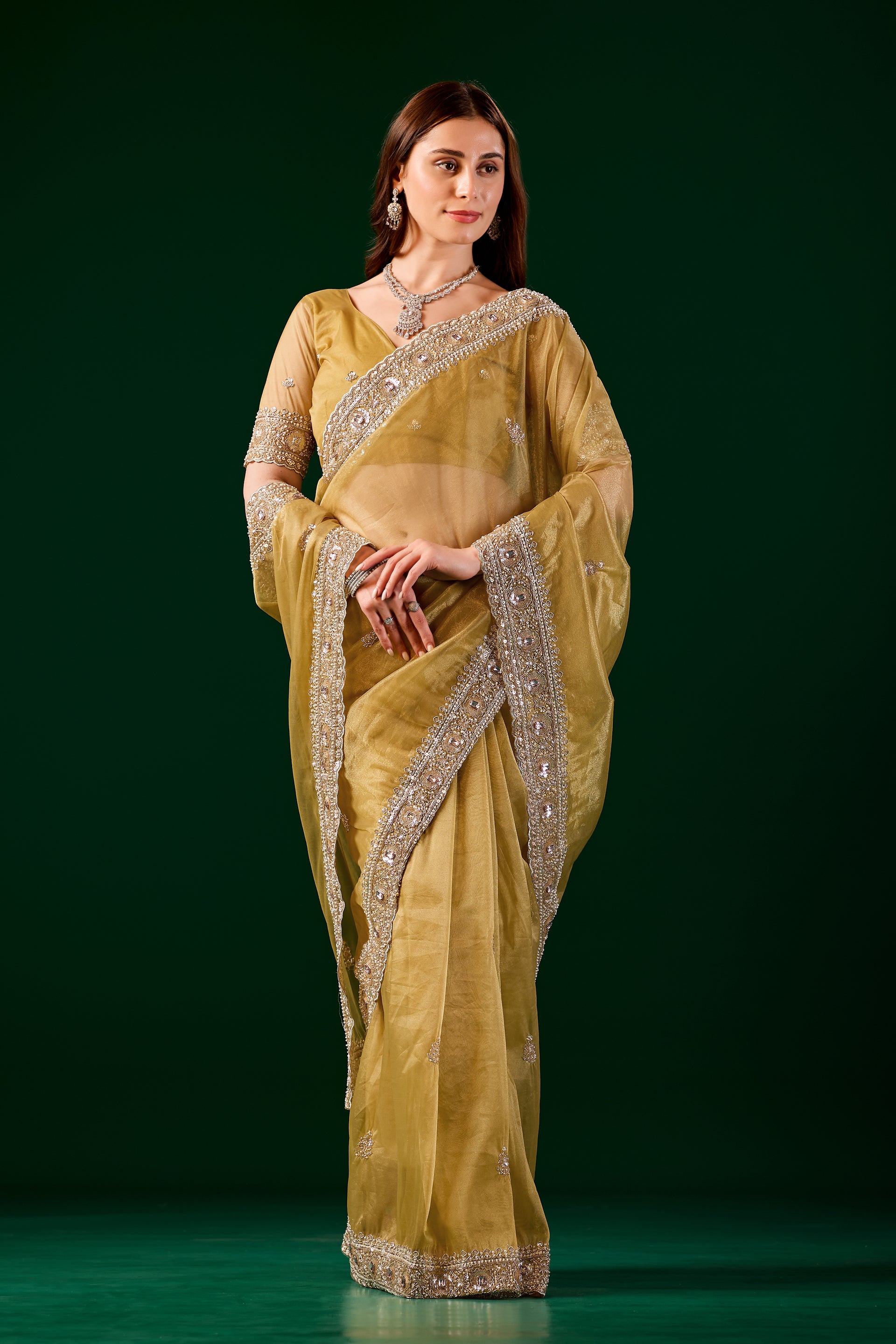 Kanyaari Kundan premium silk yellow saree with rose gold cutdana work, showcasing intricate embroidery and elegant drape.