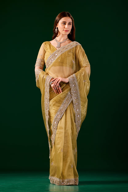 Kanyaari Kundan premium silk yellow saree with rose gold cutdana work, showcasing intricate embroidery and elegant drape.