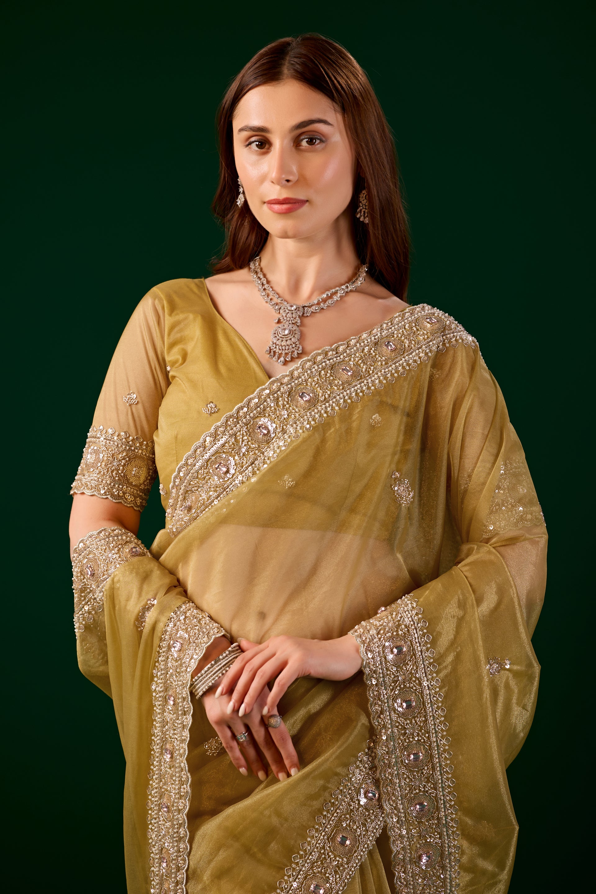 Kanyaari Kundan premium silk yellow saree with rose gold cutdana work, showcasing intricate embroidery and traditional design.