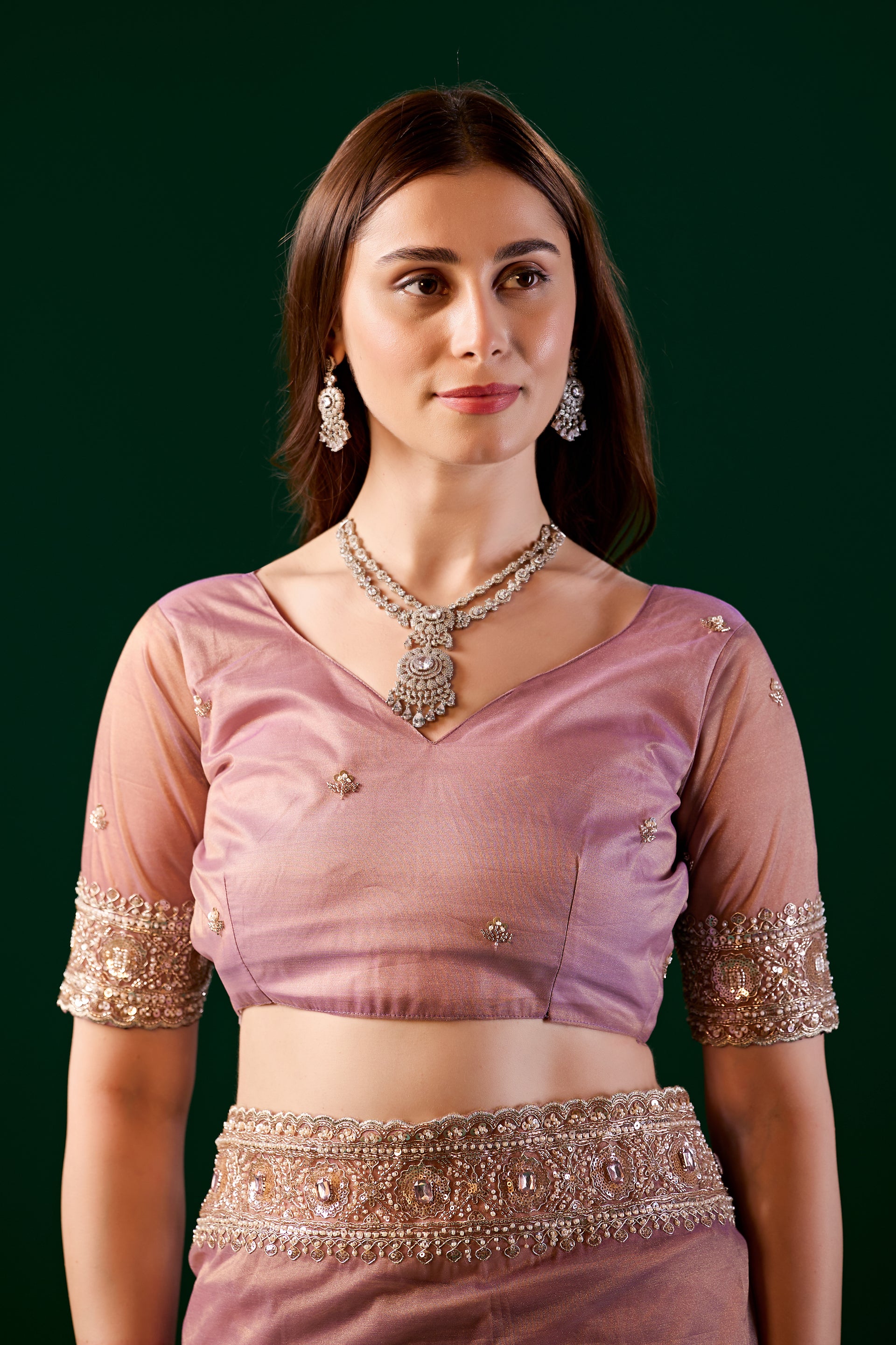 Kanyaari Kundan premium pink silk saree with rose gold cutdana work, showcasing intricate embroidery and elegant drape.