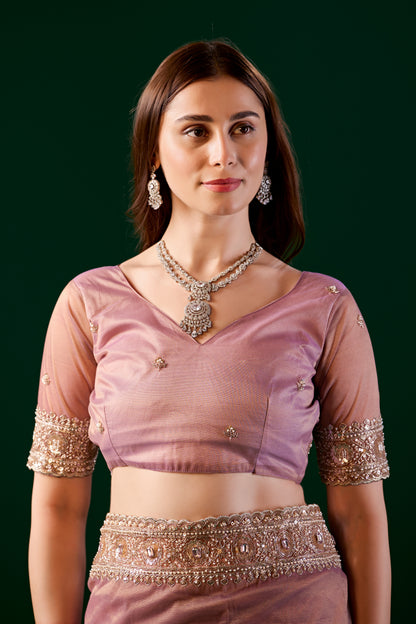 Kanyaari Kundan premium pink silk saree with rose gold cutdana work, showcasing intricate embroidery and elegant drape.