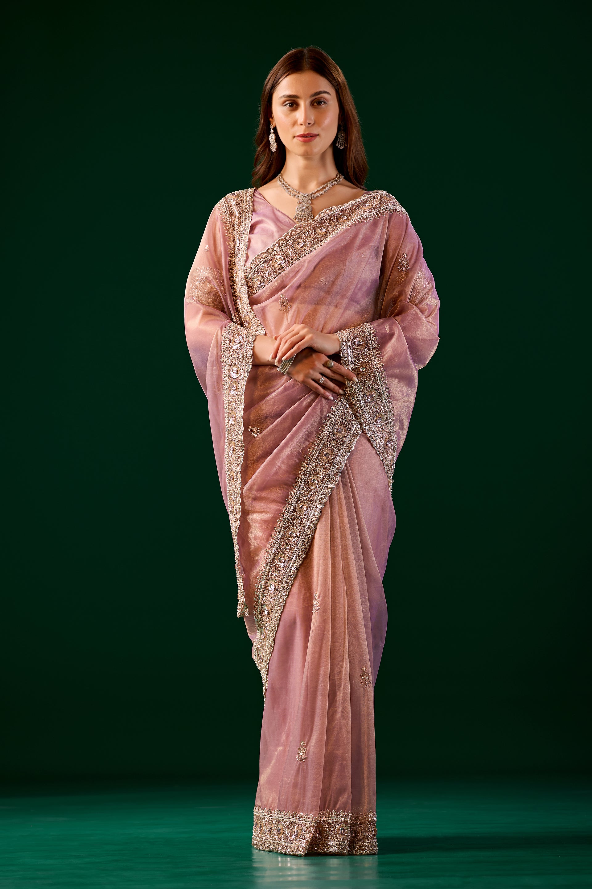 Kanyaari pink silk saree with rose gold cutdana work, showcasing intricate embroidery and traditional Kundan design.