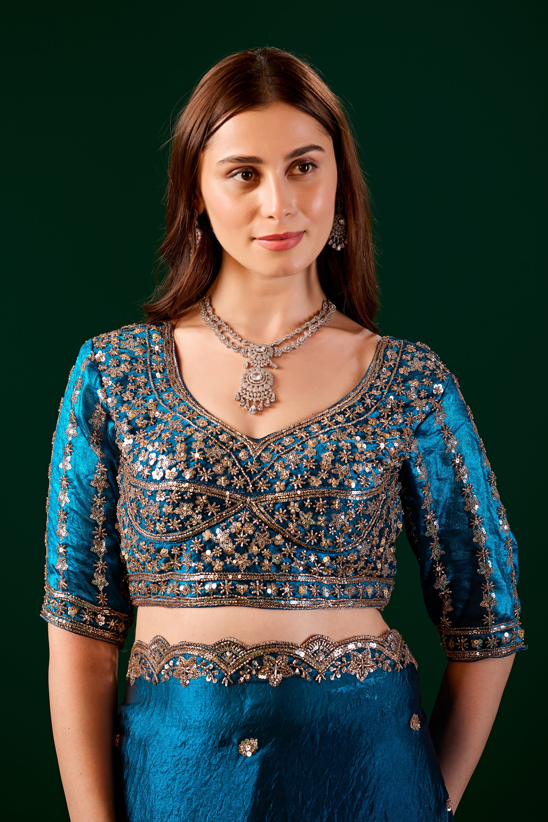 Blue Kanyaari saree with heavy fabric and intricate cutdana work, showcasing elegant traditional craftsmanship.