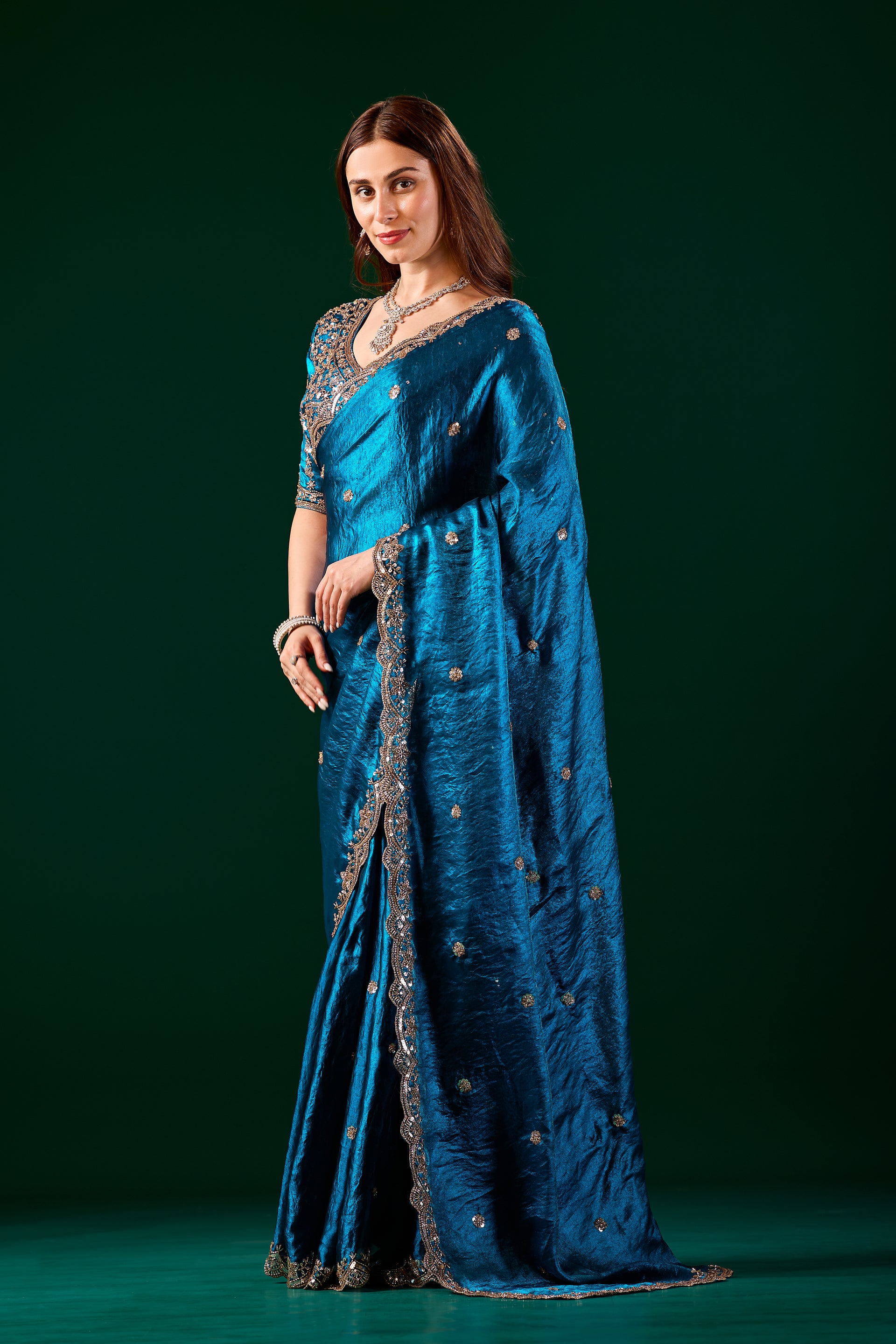 Blue Kanyaari saree with heavy fabric and intricate cutdana work, showcasing traditional craftsmanship and elegant draping.