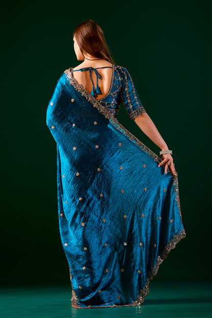 Blue heavy saree with intricate cutdana work by Kanyaari, featuring traditional embroidery and elegant drape.