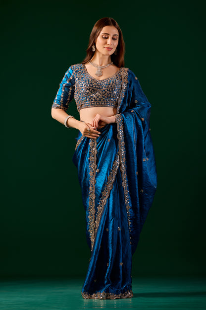 Blue heavy saree with intricate cutdana work by Kanyaari, featuring traditional design and elegant draping.