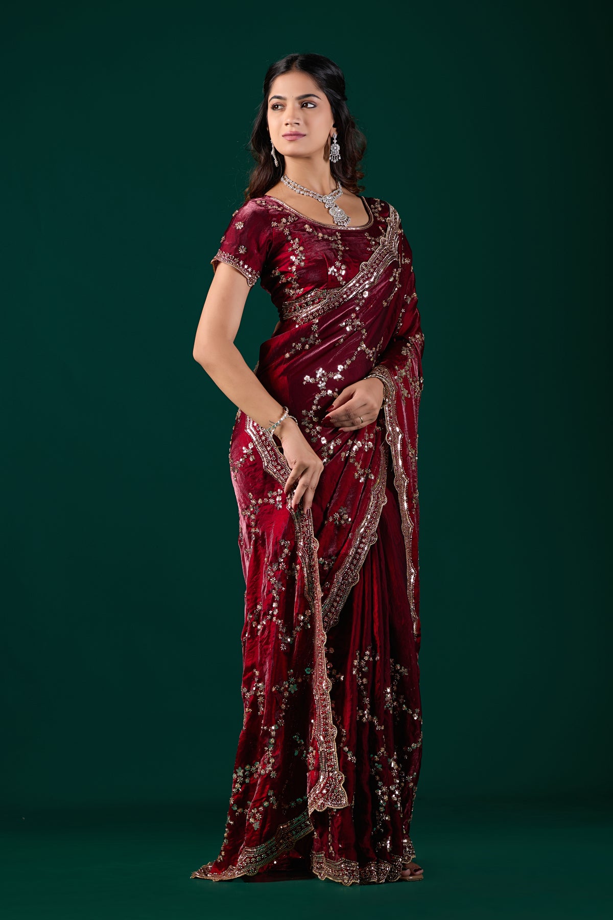 Nakhrali premium maroon silk saree by Kanyaari with rose gold cutdana work, showcasing intricate embroidery and elegant drape.