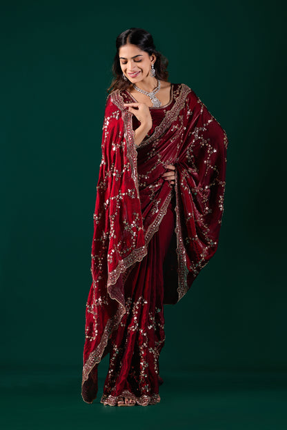 Nakhrali Kanyaari silk maroon saree with rose gold cutdana work, showcasing intricate embroidery and elegant drape.