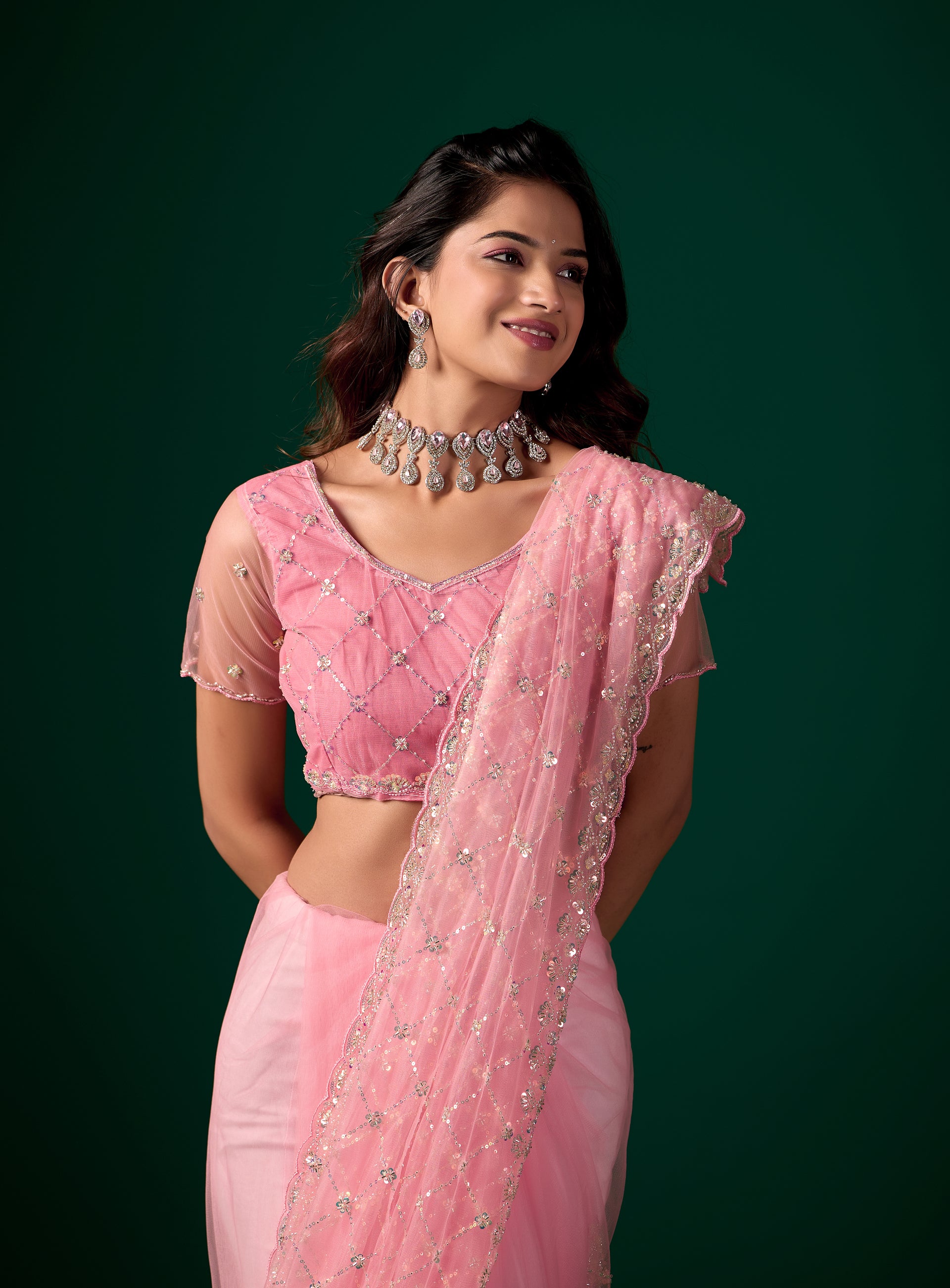 Pink Kanyaari saree with stylish cutdana work, perfect for parties, featuring elegant drape and intricate detailing.
