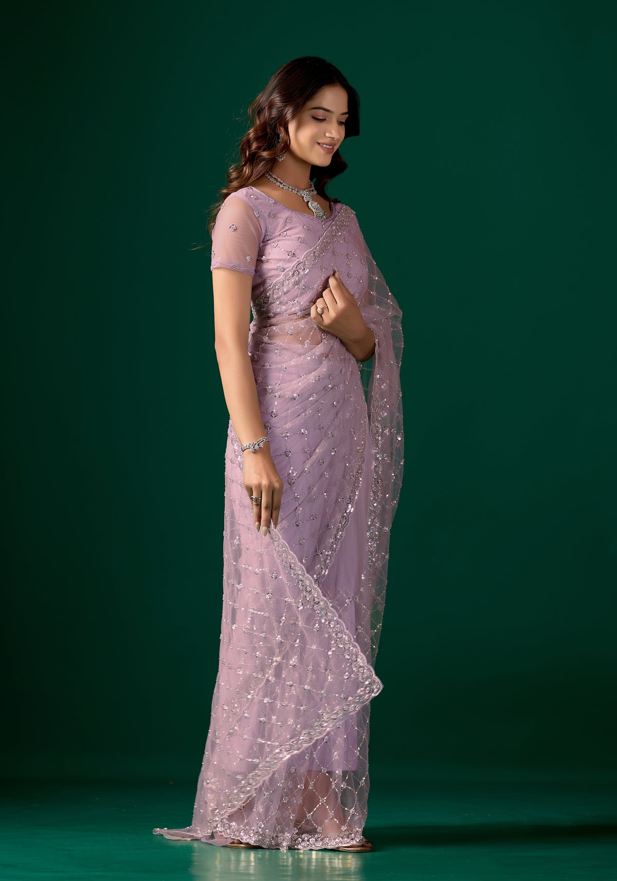 Lavender party wear saree with cutdana work by Kanyaari, featuring elegant drape and intricate embellishments for stylish occasions.